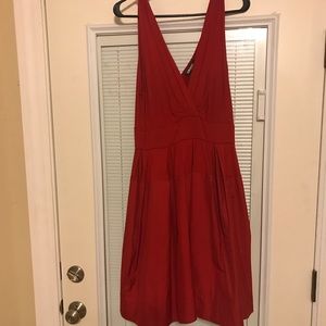 DKNY red dress with deep V in front and back